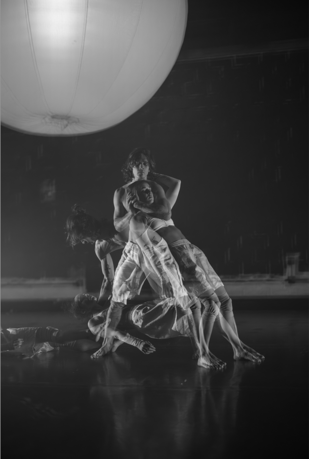 Images of two dancers in white with multiple exposures from the dance.